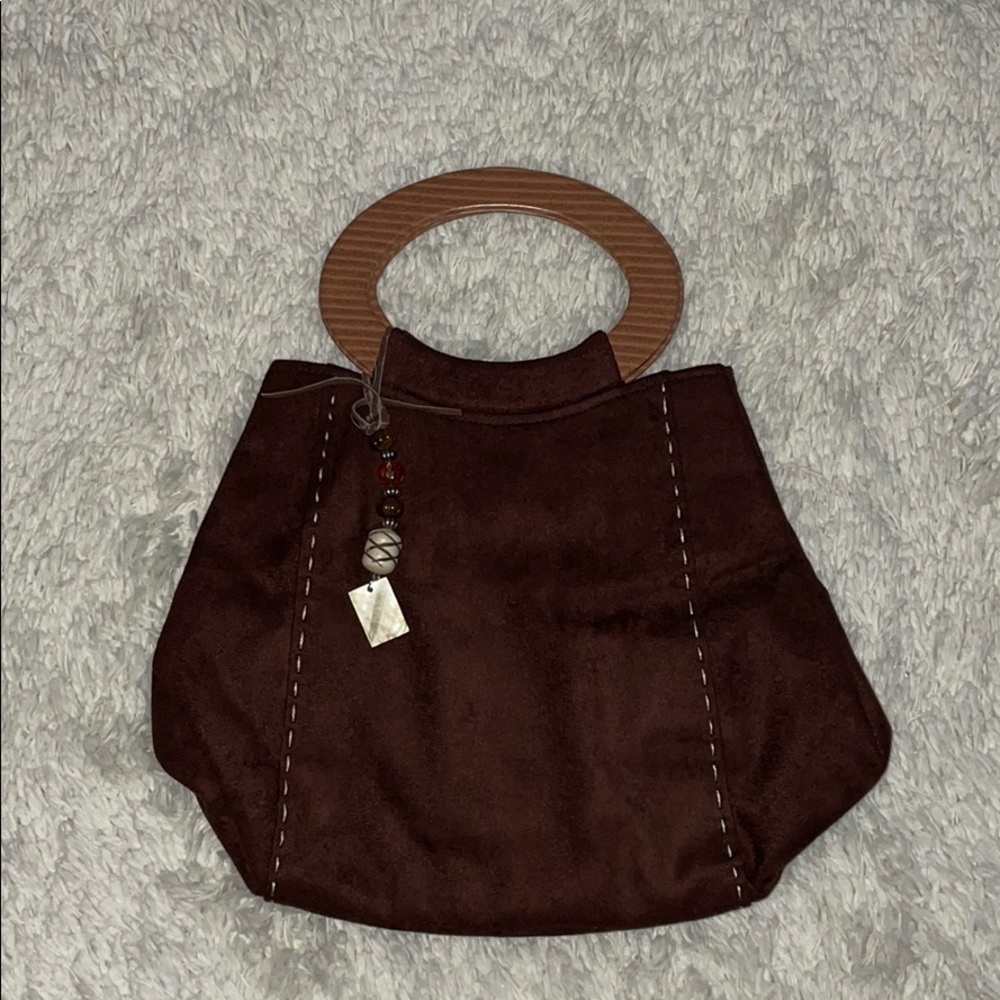 Brown suede bag with cute handle.